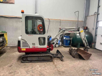 Excavator tracks Takeuchi TB016 met machinetrailer